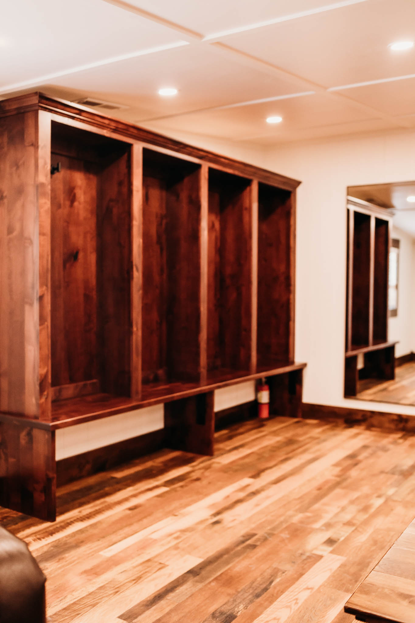 Four, large dark walnut lockers in the groom's getting ready suite at The VeNue Event Space