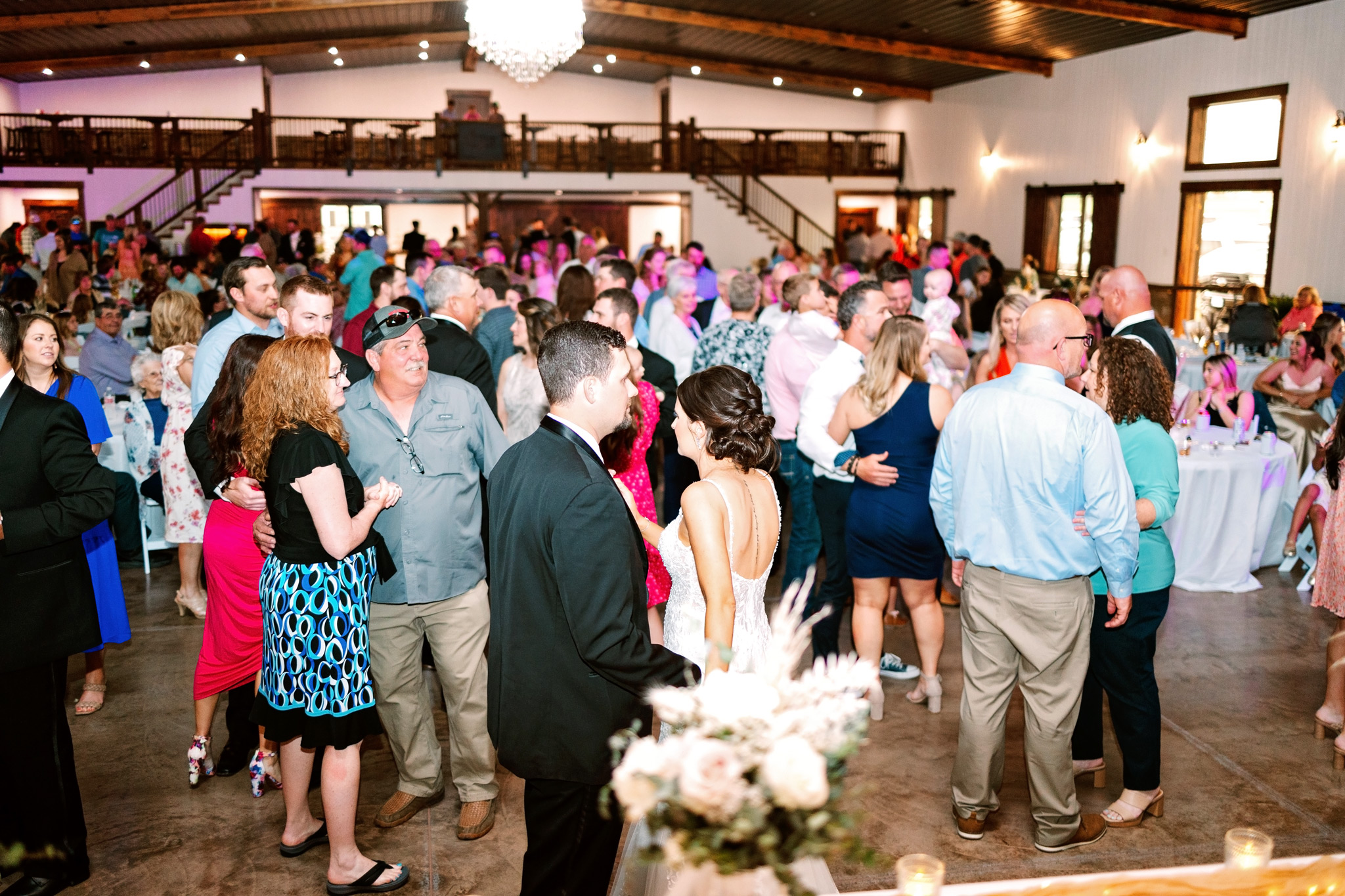 A large group of people on the dance floor at The VeNue Event Space
